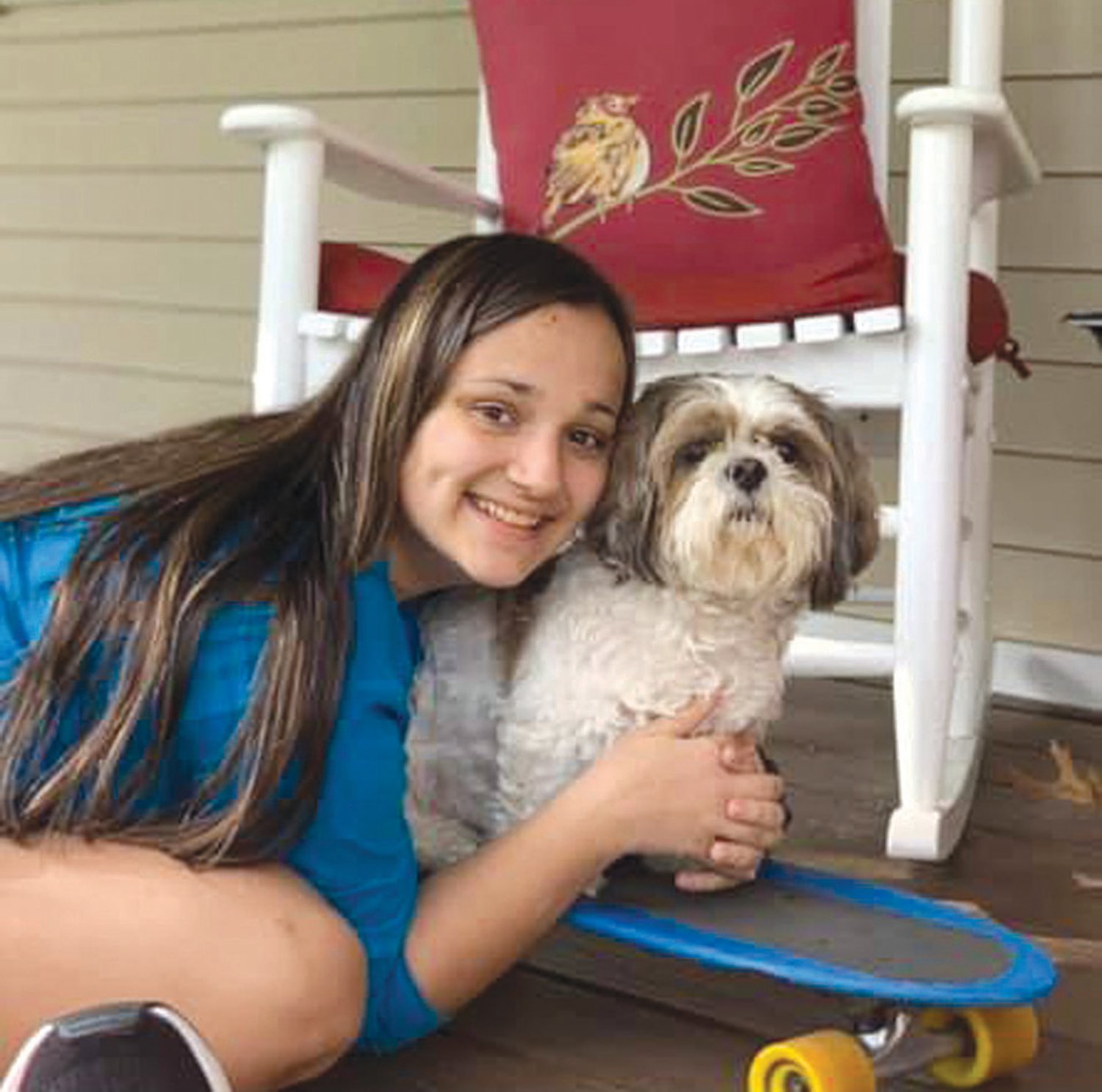 GOOD FRIENDS:Olivia Passaretti poses for a photo with her dog Sonny.